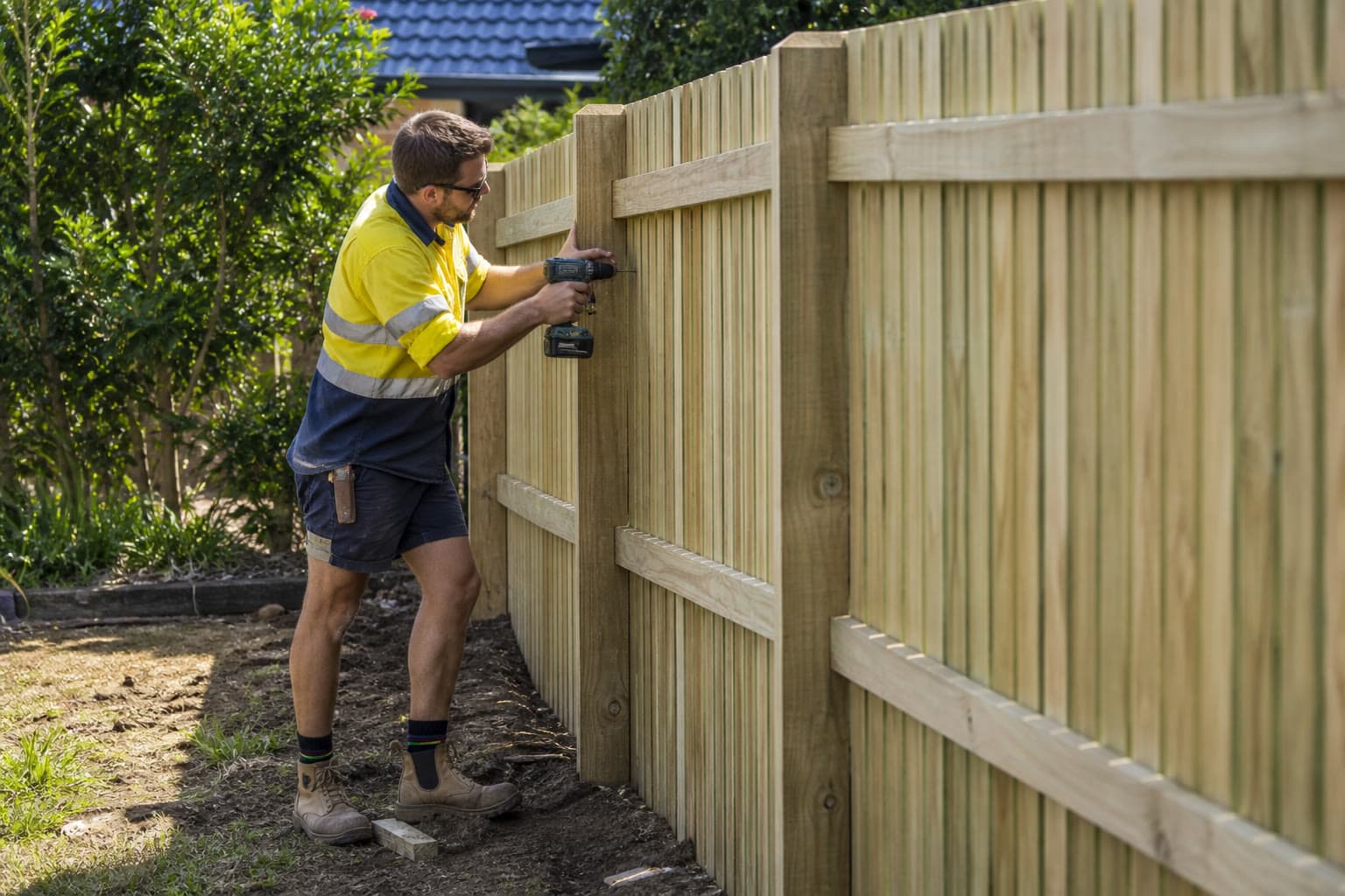 Fencer installing a residential ColorBond boundary fence