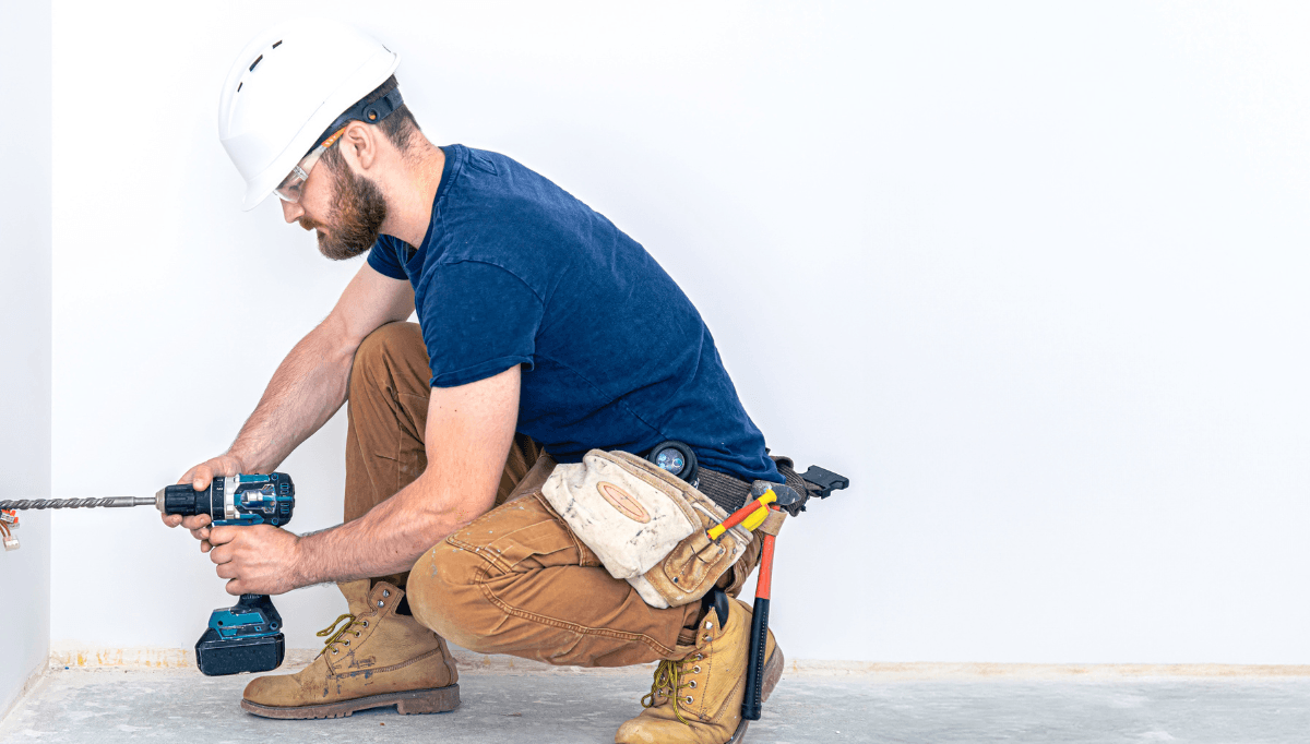 Tradie on a residential site scoping the job