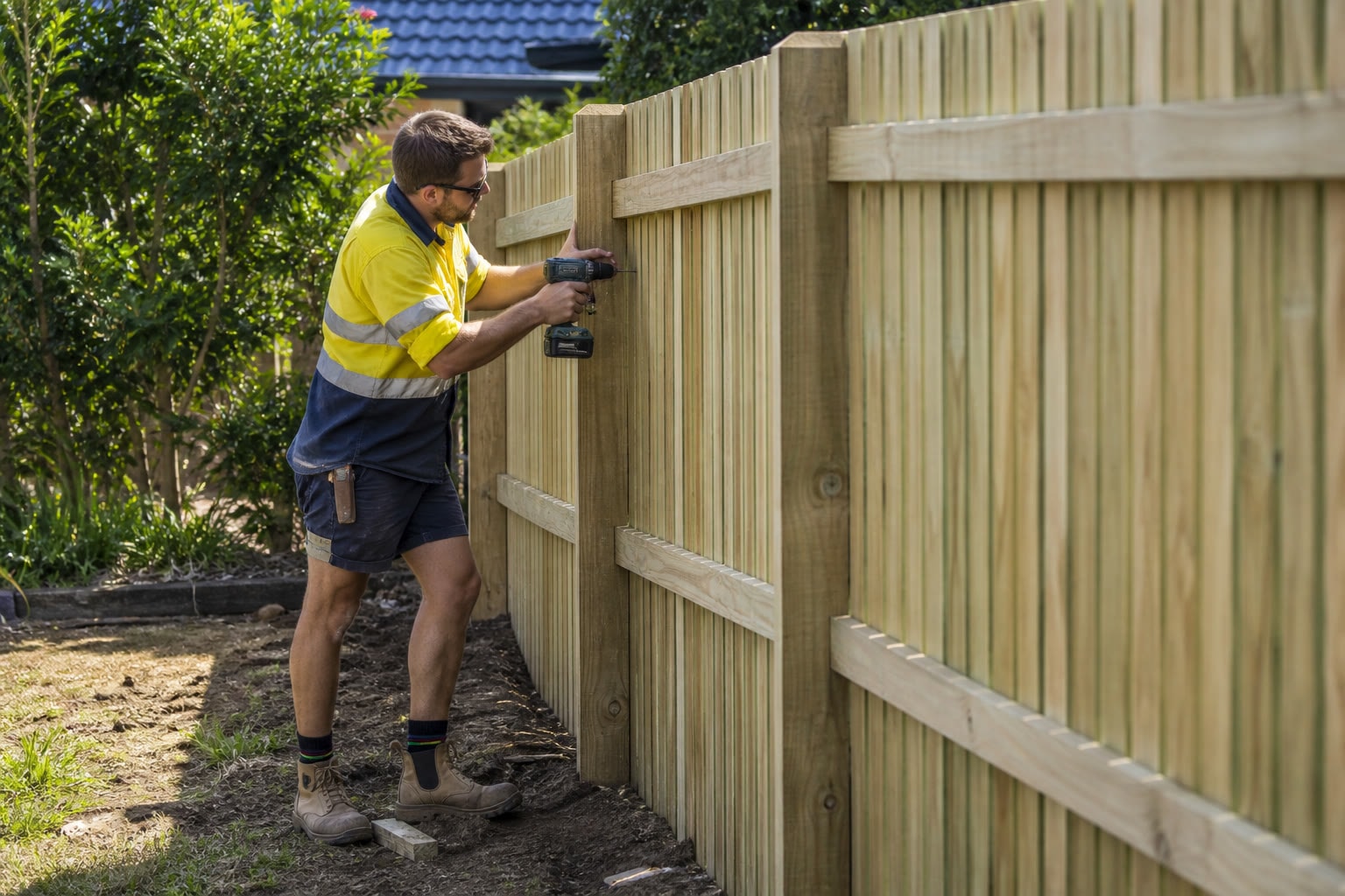 Fencer installing a residential ColorBond boundary fence